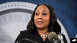 FILE - Fulton County (Ga.) District Attorney Fani Willis speaks in the Fulton County Government Center during a news conference in Atlanta, Aug. 14, 2023.