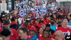 United Auto Workers members march through downtown Detroit, Michigan, Sept. 15, 2023. 