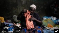 Funmilayo Kotun, a 66-year-old malaria patient, is photographed in her one room in the Makoko neighborhood of Lagos, Nigeria, April 20, 2024.