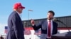 FILE - Sen. J.D. Vance, right, points toward Republican presidential candidate former President Donald Trump at a campaign rally, March 16, 2024, in Vandalia, Ohio. Trump on Monday picked Vance as his running mate.