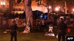 Los Angeles Police Department officers dismantle the pro-Palestinian encampment on Alumni Park at the University of Southern California (USC) in Los Angeles, California, on May 5, 2024.
