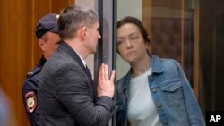 FILE - Alsu Kurmasheva, an editor for the U.S. government-funded Radio Free Europe/Radio Liberty's Tatar-Bashkir Service, listens to her lawyer during a court hearing in Kazan, Russia, May 31, 2024.