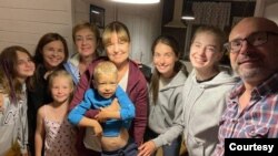 Natalia Kostykiewicz-Kolasinska's family poses with the Ukrainian family it hosted. (Courtesy - Natalia Kostykiewicz-Kolasinska)