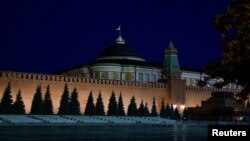 FILE - A view shows Red Square with Lenin's mausoleum as the Russian flag flies on the dome of the Kremlin Senate building in Moscow, June 24, 2023. 