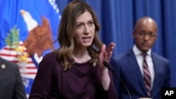 United States Drug Enforcement Administrator Anne Milgram, left, speaks as U.S. Attorney for the Southern District of New York Damian Williams, right, listens during a news conference at the Justice Department in Washington, April 14, 2023. 