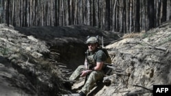 A Ukrainian infantryman of the 63rd brigade poses for a photo during an interview with AFP in Ukraine's Donetsk region on May 7, 2024.