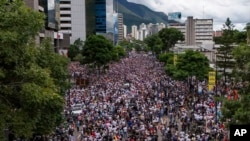FILE - Protesters demonstrate against the National Election Council certification of President Nicolas Maduro's reelection in Caracas, Venezuela, July 30, 2024, two days after the presidential vote.