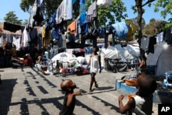 Children play in the courtyard of a shelter for families displaced by gang violence, in Port-au-Prince, Haiti, March 14, 2024.