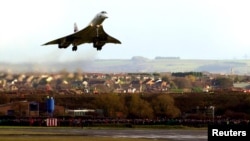 FILE - British Airways' Concorde lands after its last flight from London's Heathrow airport at Filton airport in Bristol, western England, Nov. 26, 2003.