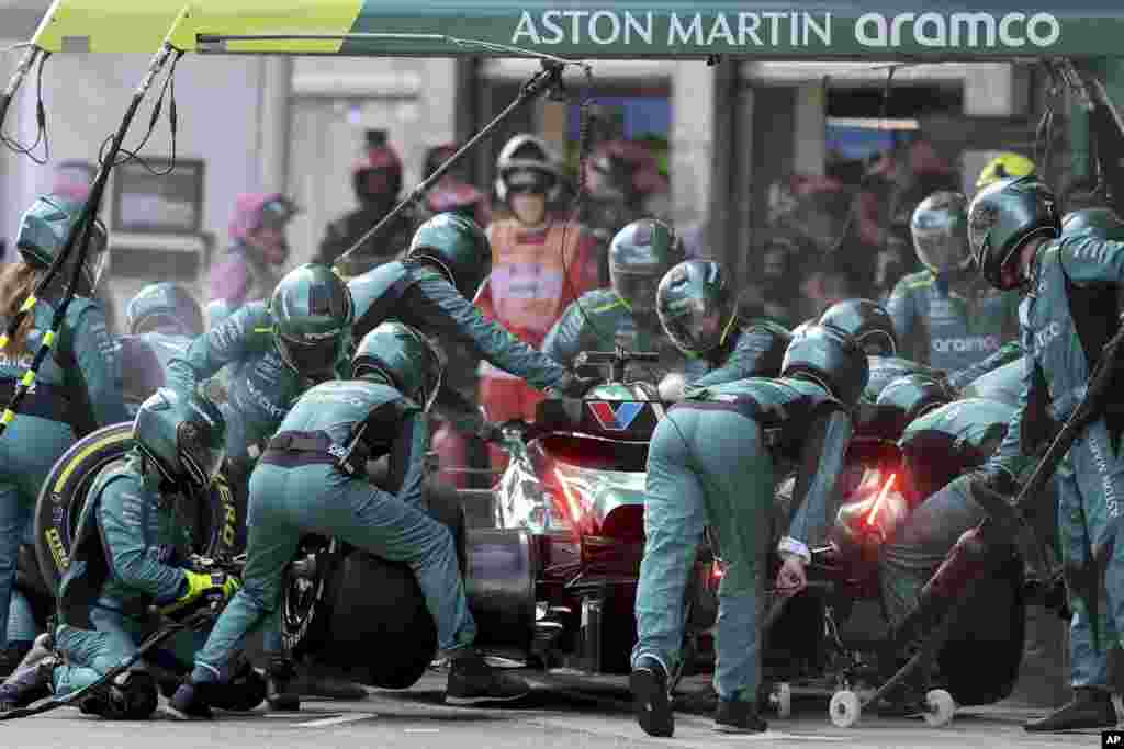 Aston Martin driver Lance Stroll of Canada changes tires at his box during the Formula 1 Spanish Grand Prix race at the Barcelona Catalunya racetrack in Montmelo, near Barcelona, Spain.