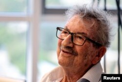 Holocaust survivor, Daniel Louz, 90, from Kibbutz Beeri, who also survived the deadly October 7 attack by the Palestinian Islamist group Hamas, speaks during an interview with Reuters in Herzliya, Israel, May 1, 2024.