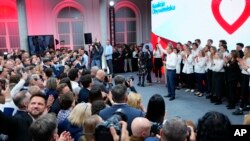 Donald Tusk, leader of Poland's largest opposition party, the Civic Coalition, addresses supporters in Warsaw, Oct. 15, 2023. 