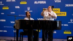Ukrainian singer Jerry Heil, left, and rapper alyona alyona perform a song in Kyiv, Ukraine, April 25, 2024.