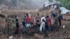 FILE - In this photo taken on March 17, 2023, Malawi Defense Force soldiers and civilians work to recover body of a victim of a mudslide from heavy rains after Cyclone Freddy during a rescue operation in Blantyre, Malawi.