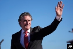 FILE - North Dakota Governor Doug Burgum waves to the crowd at a rally in Wildwood, New Jersey, May 11, 2024. On Friday, U.S. President-elect Donald Trump announced Burgum would lead a new National Energy Council.