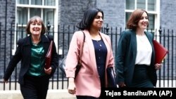 Britain's Welsh Secretary Jo Stevens, left, Justice Secretary Shabana Mahmood, center, and Education Secretary Bridget Phillipson leave 10 Downing Street, London, July 6, 2024, after Prime Minister Starmer's first Cabinet meeting.