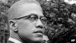 FILE - In this 1963 photo, Malcolm X attends a rally in the Harlem area of New York. The Nebraska Legislature on March 28, 2024 passed a bill to recognize the civil rights icon every May 19, the day he was born Malcolm Little in Omaha in 1925. 