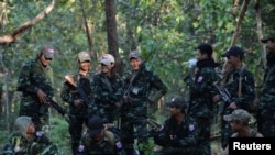 Members of the People's Defence Forces (PDF) who became guerrilla fighters after being protesters are seen on the front line in Kawkareik on December 31, 2021. (Reuters)