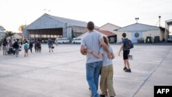 This handout photograph taken Apr. 23, 2023 shows French and other nationalities people as they disembark at French military air base in Djibouti. (Jonathan Sarago/French Ministry of Europe and Foreign Affairs /AFP) 