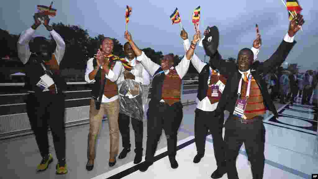Athletes of Team Uganda dance on the boat during the opening ceremony of the 2024 Summer Olympics, July 26, 2024 in Paris.