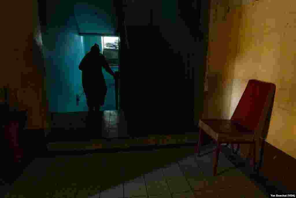 A woman enters an underground shelter inside what used to be the Velyka Novosilka, Ukraine firehouse on Aug. 23, 2023.