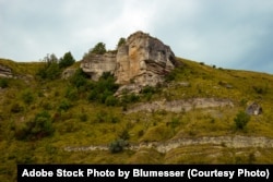 FILE - The Rocky hills of Bakota Bay in the old village were flooded after a big hydroelectricity dam was built on the Dniester River. Khmelnytskyi region, Ukraine. (Adobe Stock Photo by Blumesser)
