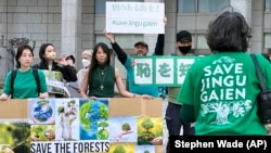 Protester against the Meiji Jingu Gaien area redevelopment project in front of the Tokyo Metropolitan Government Building April 9, 2023. (AP Photo/Stephen Wade)