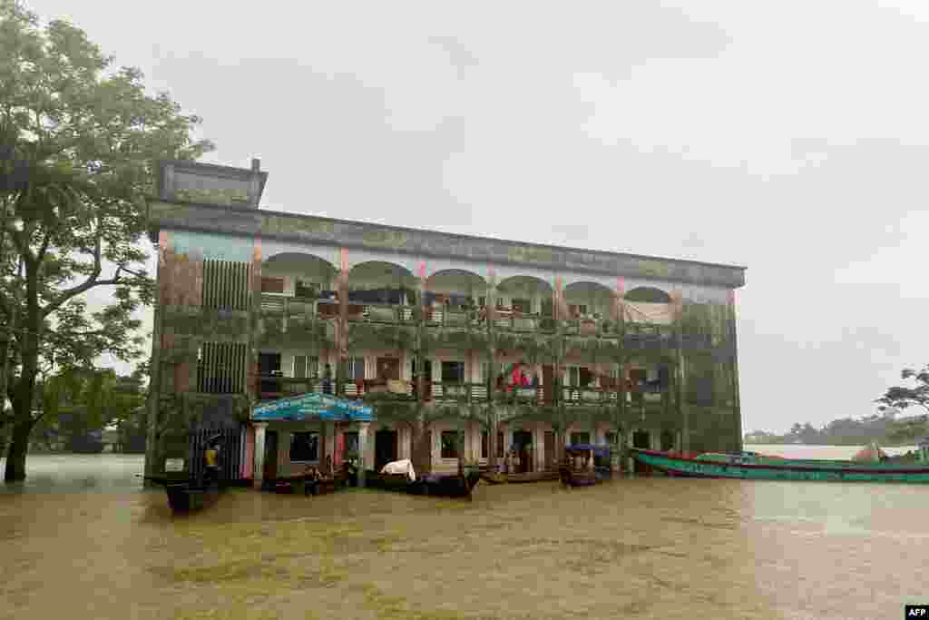 Flood affected people take temporary shelter at a school in Sylhet, Bangladesh.