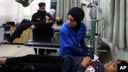 Palestinian medics treat those wounded in the Israeli bombardment of the Gaza Strip at the Kuwaiti Hospital in Rafah refugee camp, southern Gaza Strip, May 3, 2024. 