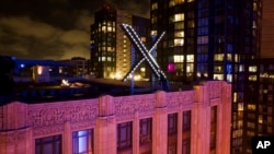 The "X" sign installed at formerly Twitter headquarters in San Francisco, July 28, 2023. X says it is trying to take action on a flood of posts sharing graphic media, violent speech and hateful context about the latest war between Israel and Hamas. (AP Photo/Noah Berger)
