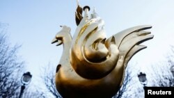 A new rooster is prepared to be installed at the top of the spire of the Notre-Dame de Paris Cathedral, which was ravaged by a fire in 2019 that sent its spire crumbling down, as restoration works continue in Paris, Dec. 16, 2023. 