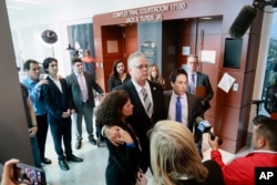 FILE - Former Marjory Stoneman Douglas High School School Resource Officer Scot Peterson speaks with the media after he was found not guilty at the Broward County Courthouse in Fort Lauderdale, Florida, June 29, 2023.