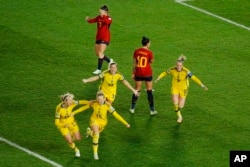 Sweden's Rebecka Blomqvist, second left, celebrates with teammates after scoring her side's first goal during the Women's World Cup semifinal soccer match between Sweden and Spain at Eden Park in Auckland, New Zealand, Aug. 15, 2023.
