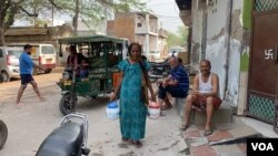 Kamlesh Devi says elderly residents like her cannot cope with the elbowing and pushing that ensues when water trucks arrive. (Anjana Pasricha/VOA)