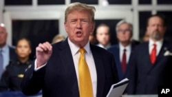 Former President Donald Trump speaks to reporters at Manhattan Criminal Court, May 21, 2024, in New York. 