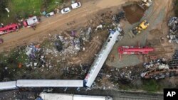 The wreckage of the trains lie on the rail lines, after Tuesday's rail crash the country's deadliest on record, in Tempe, about 376 kilometers north of Athens, near Larissa city, Greece, March 3, 2023.