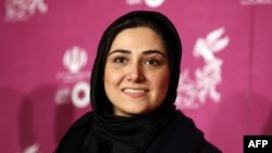 FILE - Iranian actor Baran Kosari is pictured at the 34th edition of the Fajr International Film Festival on Feb. 3, 2015, in Tehran. Kosari and fellow actor Shaghayegh Dehghan have been charged with violating Iran's dress code for women, local media reported May 8, 2023.