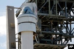 Boeing's Starliner capsule atop an Atlas V rocket stands ready for its upcoming mission at the Cape Canaveral Space Force Station, Sunday, May 5, 2024, in Cape Canaveral, Fla. Launch is scheduled for Monday evening. (AP Photo/Terry Renna)