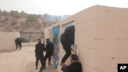 This image from video posted to social media by Hamas on Sept. 12, 2023, shows a live-fire exercise dubbed operation "Strong Pillar" outside Al-Mawasi, a Palestinian town on the southern coast of the Gaza Strip. (Hamas via AP)