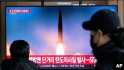 FILE - A TV screen shows a North Korean missile launch during a news program at the Seoul Railway Station in South Korea, Dec. 18, 2023. Some analysts say the U.S. should impose new sanctions on China to pressure Beijing into cracking down on North Korea's weapons programs.
