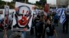 People take part in a protest against Israeli Prime Minister Benjamin Netanyahu's government, outside of the Knesset, Israel's parliament, in Jerusalem, March 31, 2024.