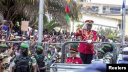 FILE - Gabon coup leader General Brice Clotaire Oligui Nguema waves after being sworn in as interim president in Libreville on Sept, 4, 2023. The U.S. ambassador to Gabon met with Nguema on Feb. 20, 2024, and urged a quick return to constitutional order.