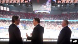 U.S. Secretary of State Antony Blinken talks with U.S. Ambassador to China Nicholas Burns, center, with U.S. Consulate General in Shanghai Scott Walker while attending a basketball game at the Shanghai Indoor Stadium, in China, April 24, 2024.