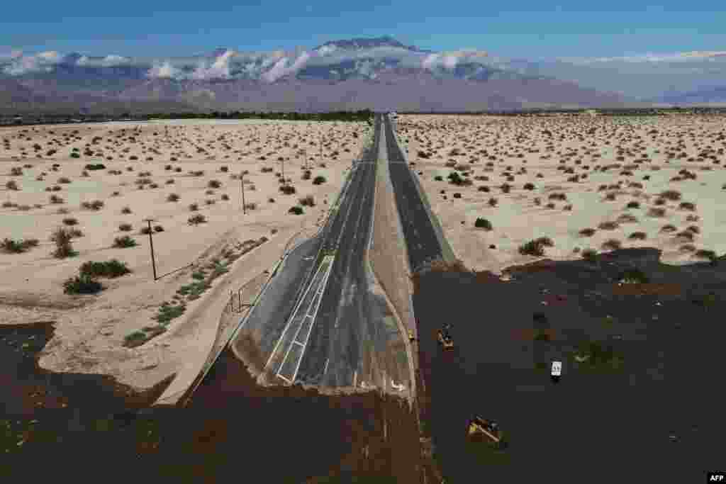 An aerial image shows no traffic on Interstate 10 due to flooding and mud on the highway following heavy rains from Tropical Storm Hilary, in Rancho Mirage, California, Aug. 21, 2023.