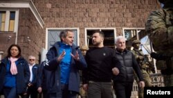 International Atomic Energy Agency (IAEA) Director General Rafael Grossi speaks to Ukraine's President Volodymyr Zelenskyy as they visit Dnipro Hydroelectric Power Plant, March 27, 2023.