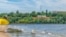 FILE - Strilka beach on the Inhul River in Mykolaiv, Ukraine. City beach near shallow water and the inscription Mykolaiv on the shore on July 26, 2020 (Adobe stock photo)