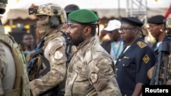 Mali's junta leader Assimi Goita arrives to attend the last campaign rally of the "Yes" group for the referendum on constitutional amendments that would return the country to constitutional rule, in Bamako, June 16, 2023.