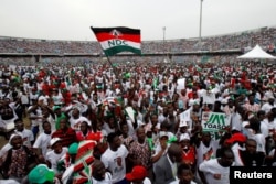 FILE - Supporters of John Dramani Mahama, Ghana's president and National Democratic Congress (NDC) presidential candidate attend his rally at Accra sport stadium, in Accra, Ghana, Dec. 5, 2016.