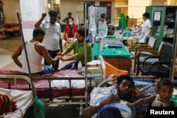 Dengue-infected people are hospitalized for treatment at Mugda Medical College and Hospital, as the yearly death toll from the disease has surpassed the previous record in the country, in Dhaka, Bangladesh, Sept. 5, 2023.