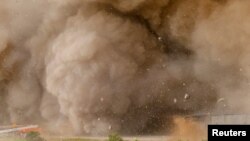 Rocks and other debris fly around remote cameras as SpaceX’s next-generation Starship spacecraft atop the Super Heavy rocket lifts off from the company’s Boca Chica launchpad near Brownsville, Texas, U.S. April 20, 2023. (REUTERS/Joe Skipper/File)